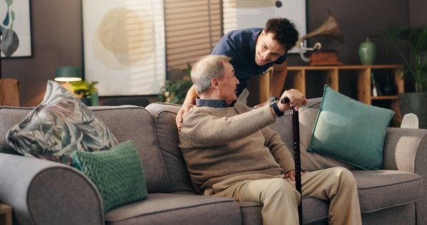 assisted-living-caregiver-helping-elderly-man-home